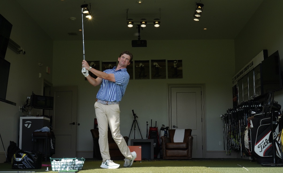 Donnie Breneman holding a balanced finish in the Ridgewood Country Club performance center.